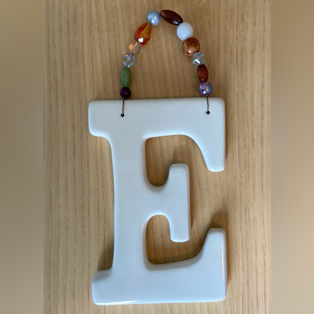 Vintage ceramic hanging beaded letter E. Monogram art